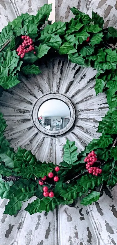 Festive green wreath with red berries on a rustic wall background.