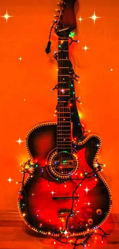 Guitar with festive lights on orange background.