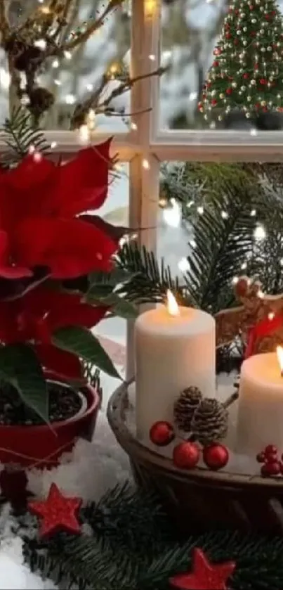 Festive holiday display with red poinsettias and glowing candles.