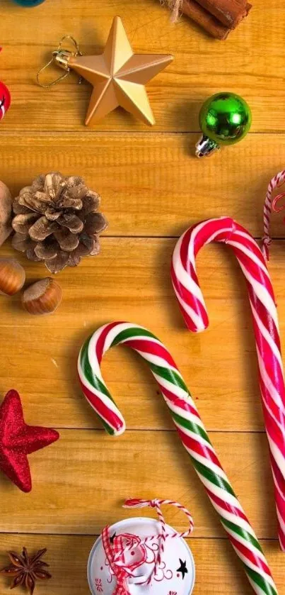 Festive wallpaper with candy canes and holiday ornaments on wooden background.