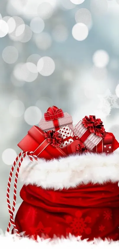 Red bag filled with gifts against a snowy background.