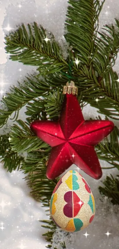 Red star and colorful ornament on snow-covered evergreen.