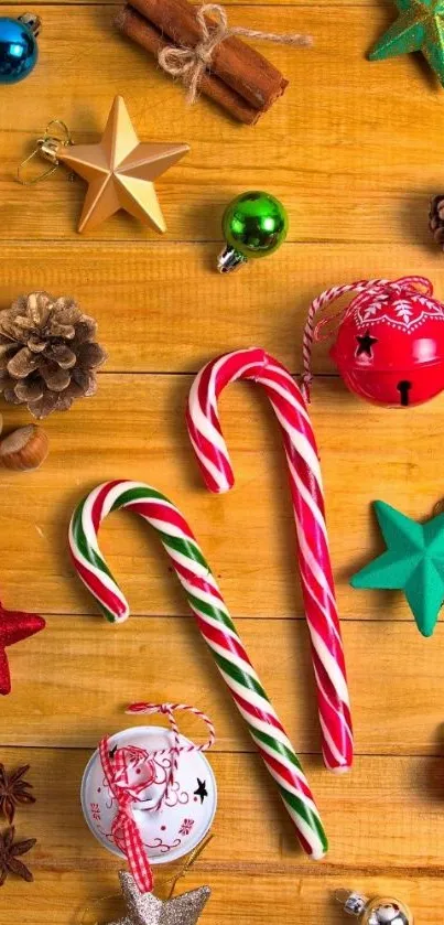 Festive holiday wallpaper with candy canes and ornaments on a wooden table.