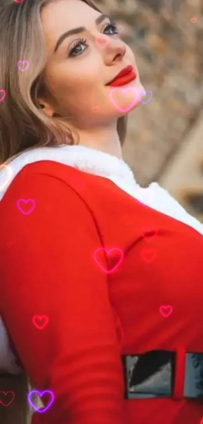 Woman in vibrant red Santa outfit posing cheerfully.