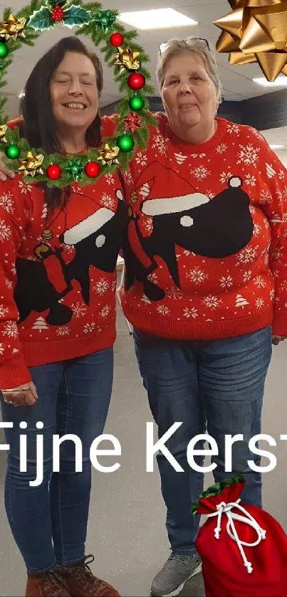 Two people in Christmas sweaters with festive decor.