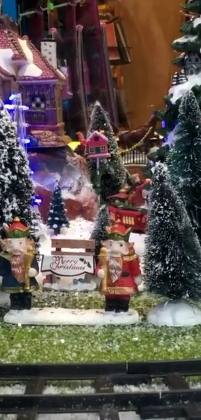 Snowy holiday village scene with Christmas trees and festive figures.