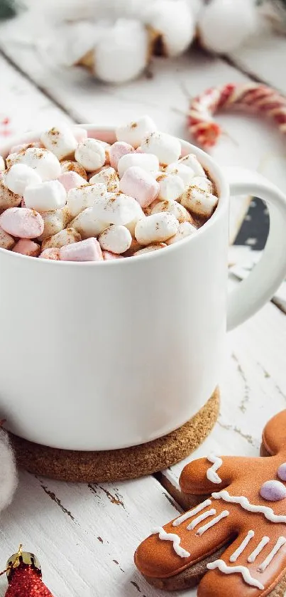 A mug of hot chocolate with marshmallows and gingerbread on wooden table.