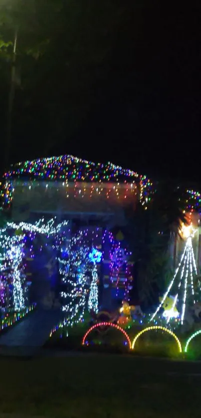 Colorful holiday lights adorning a house at night.