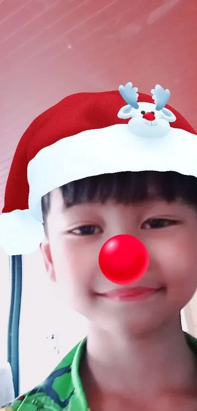 Child wearing Santa hat filter with red nose, smiling joyfully.