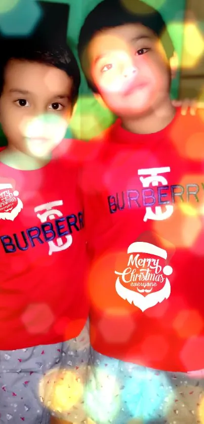 Festive kids in red shirts with bokeh lights.