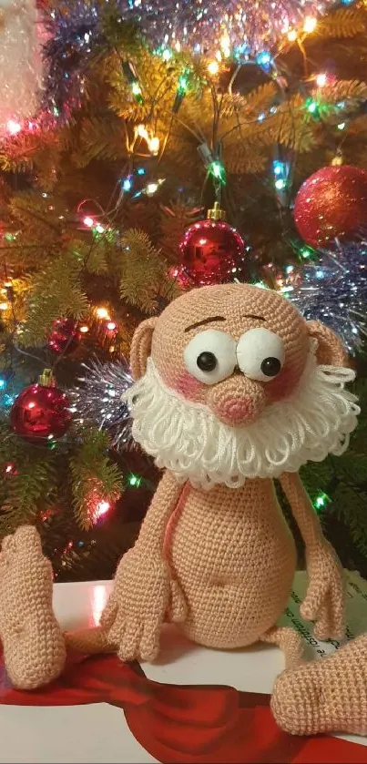 Festive knitted Santa with Christmas tree backdrop