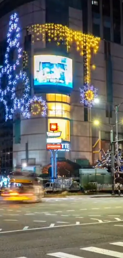 Festive city intersection with illuminated holiday decorations.