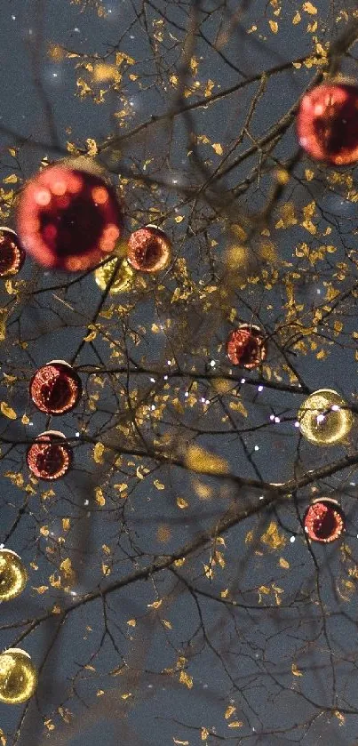 Festive tree branches with gold and red ornaments against a dark night sky.