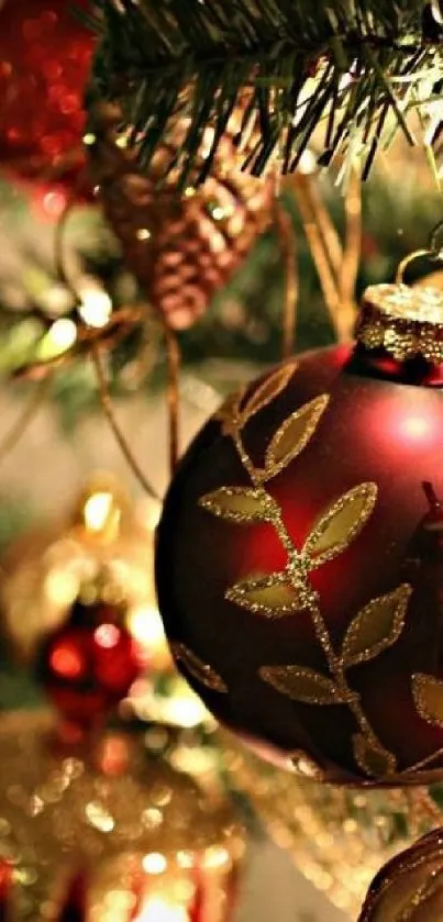 Festive red and gold Christmas ornament on a decorated tree branch.