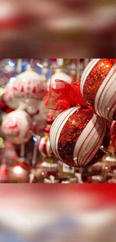 Close-up of red and white ornaments in festive holiday setting.