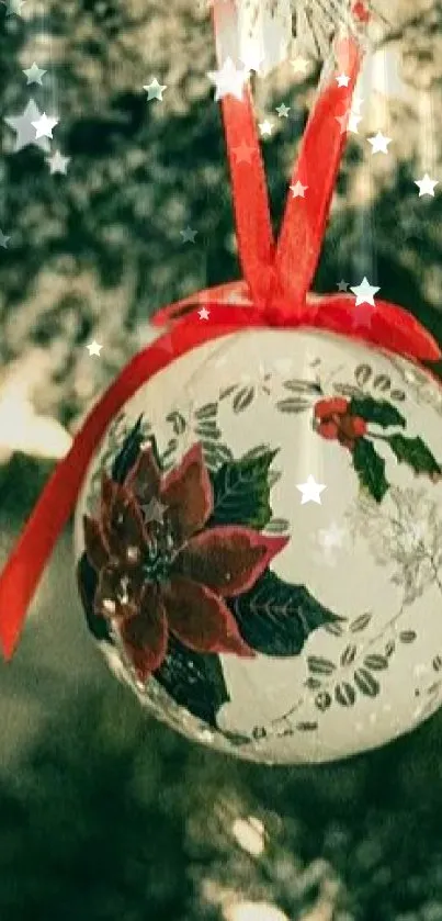 Christmas ornament hanging on snowy tree.