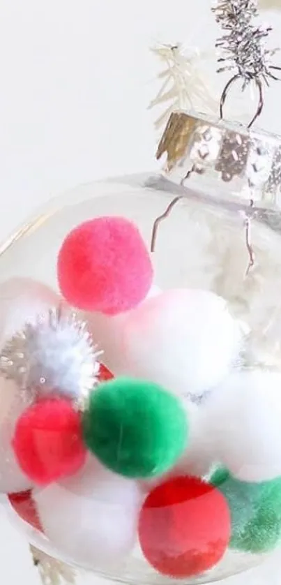 Colorful Christmas ornament with pom-poms inside.