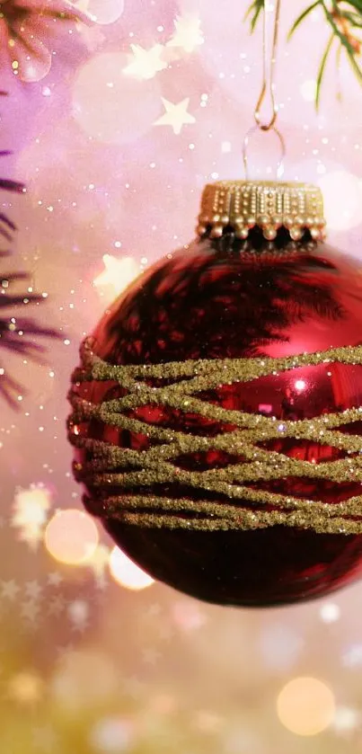 Vibrant red Christmas ornament with bokeh and pine on a festive background.