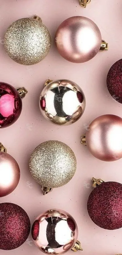 Elegant holiday ornaments on a pink background.