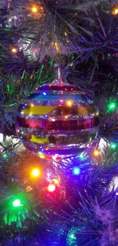 Colorful glass ornament on Christmas tree.