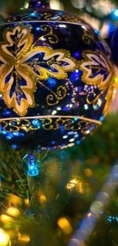 Blue and gold Christmas ornament with festive lights.