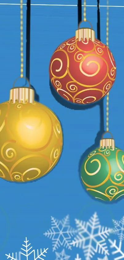 Colorful Christmas ornaments on a blue background with snowflakes.