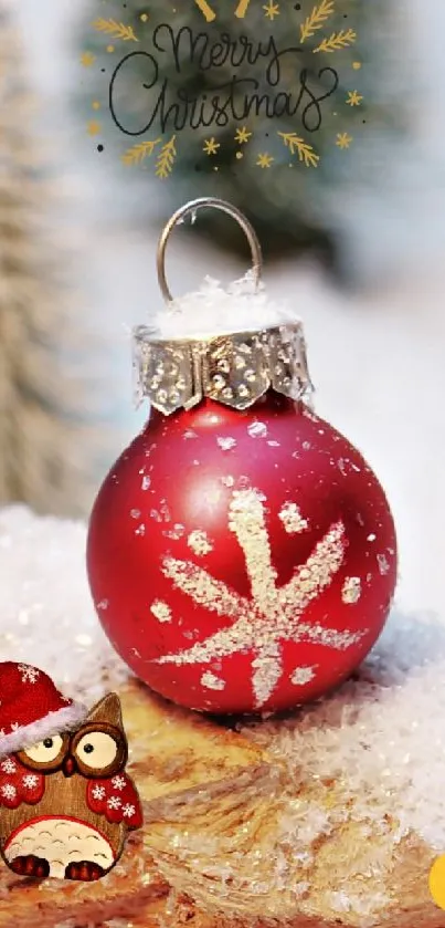 Red Christmas ornament with snow and owl.