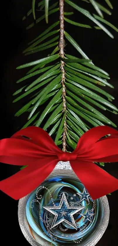 Festive mobile wallpaper with ornament, red bow, and pine needle branch.