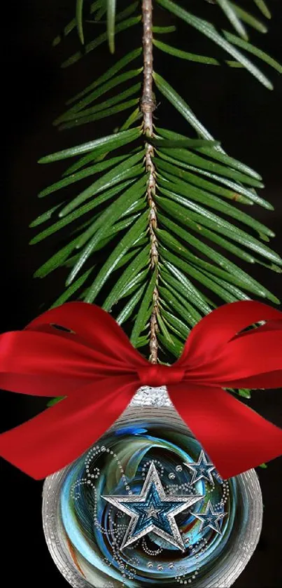 Festive ornament with red bow and stars on pine branch.