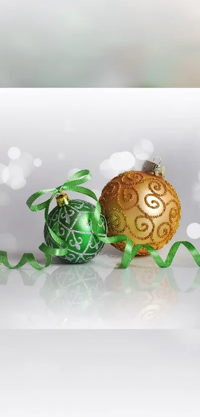 Green and gold festive ornaments with ribbon on a bokeh background.