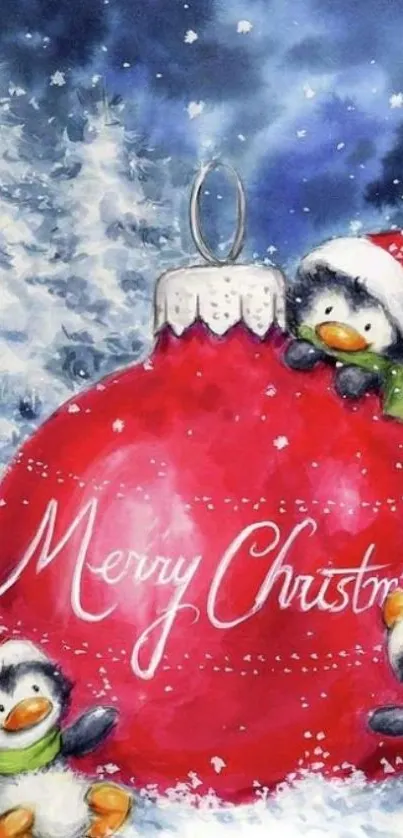 Charming Christmas scene with penguins and a red ornament in snow.