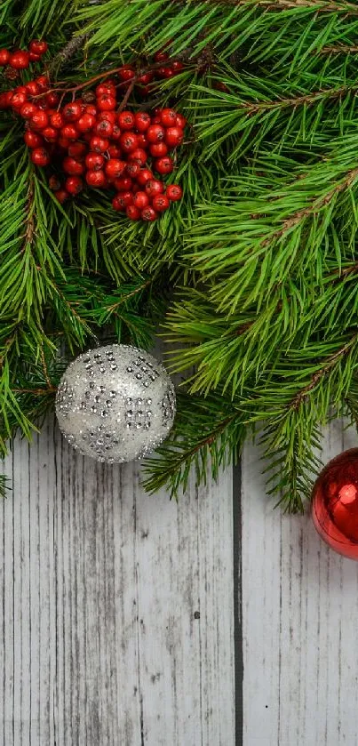 Christmas themed wallpaper with pine branches and colorful ornaments.