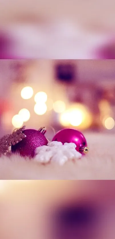 Pink holiday wallpaper with ornaments and bokeh lights.