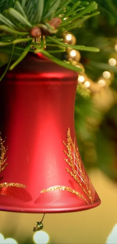 Red bell ornament on green pine wallpaper.