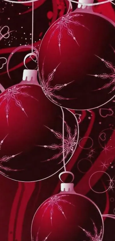 Red Christmas baubles on festive background.