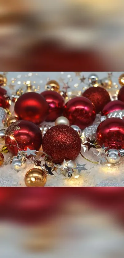 Red and gold Christmas ornaments with festive lights.