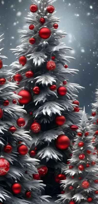 Snowy Christmas trees with red ornaments.