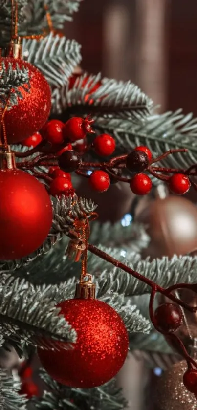 Festive Christmas tree with red ornaments and pine branches.