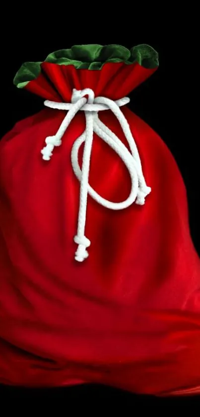 Red bag with white rope on black background.