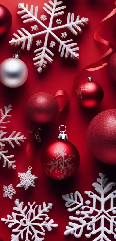 Red holiday wallpaper with snowflakes and baubles.