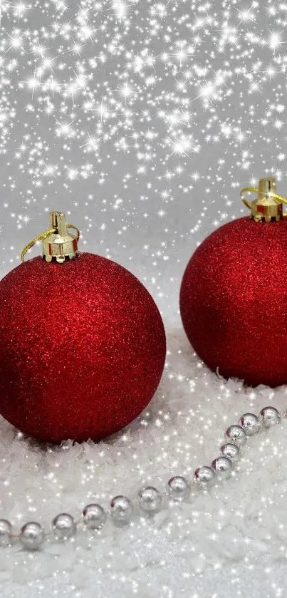 Red Christmas ornaments with snowflakes and silver beads in a festive setting.