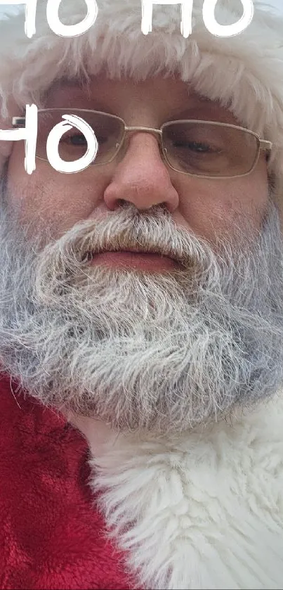 Close-up of Santa Claus's face with a snowy beard and 'Ho Ho Ho' text.