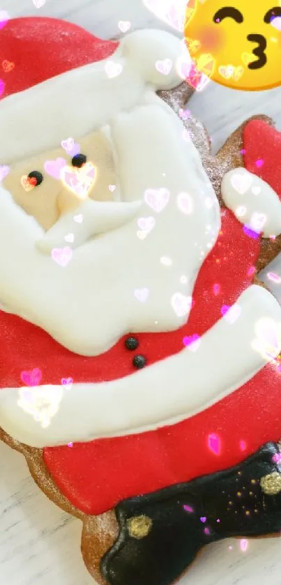 Santa-shaped cookie with Christmas trees and heart emoji on festive wallpaper.