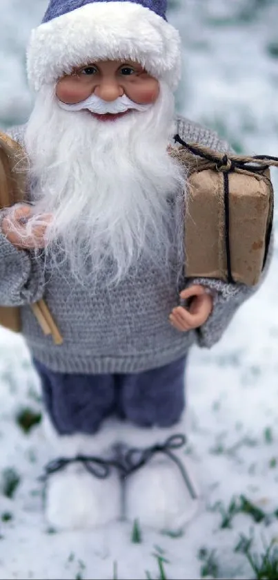 Santa Claus figure in cozy attire on snowy grass with gifts.