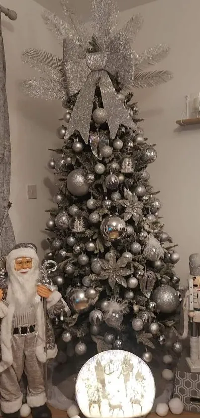 Festive silver Christmas tree with Santa and nutcracker decorations.