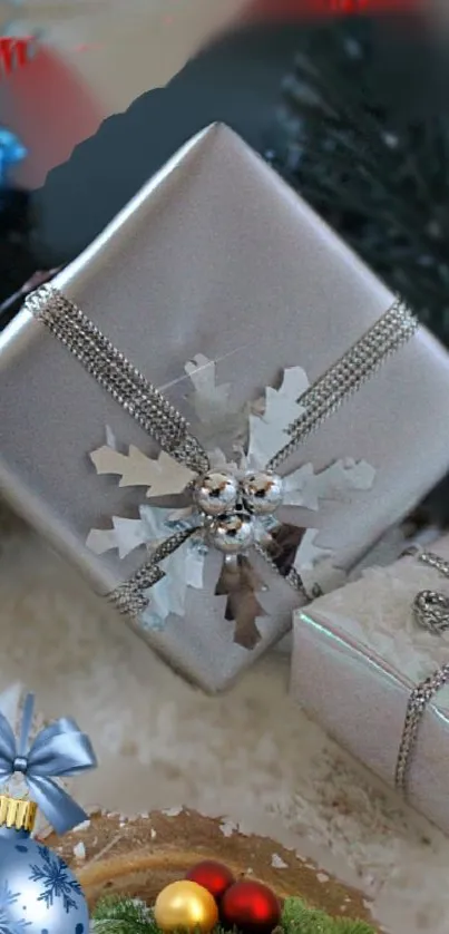 Elegant silver gift box with festive ornaments on a mobile wallpaper.