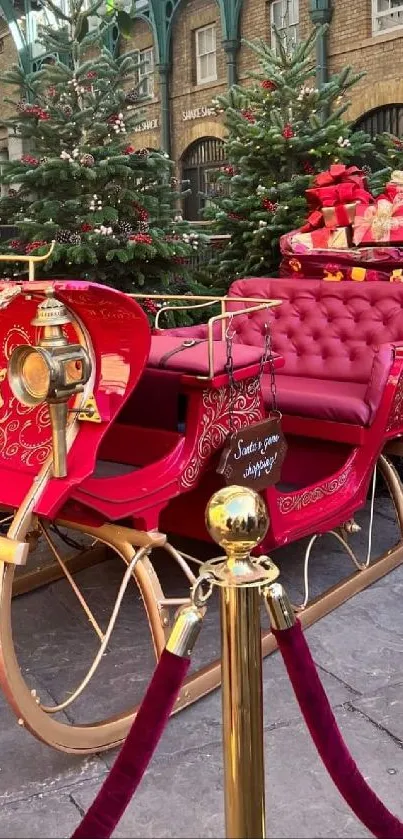 Festive red sleigh surrounded by Christmas trees.