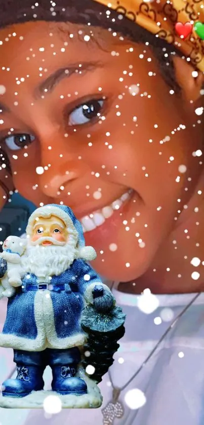 Young person with Santa figurine under snowflakes.
