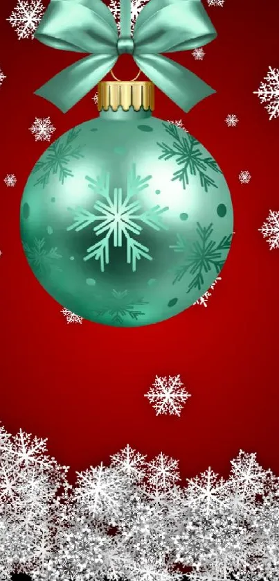 Holiday wallpaper with teal ornament and snowflakes on a red background.