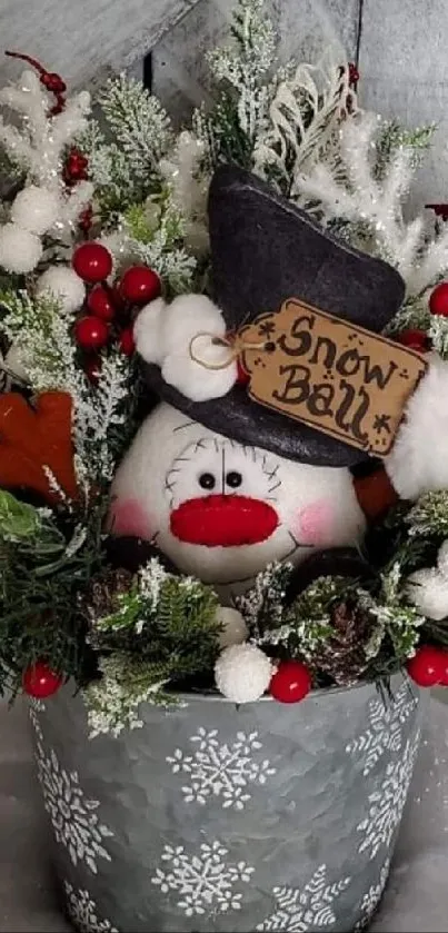 Festive snowman bouquet with berries and greenery in a snowy pot.